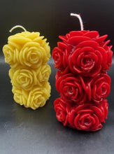 Load image into Gallery viewer, 4 1/4&quot; Rose Beeswax Candle. This beeswax candle is decorated with roses carved into the sides and top of the candle.

