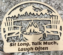 Load image into Gallery viewer, It&#39;s time to gather friends and loved ones together &amp; enjoy some fireside patio time!  This adorable sign will is the perfect decor for your patio reminding everyone to Sit Long, Talk Much &amp; Laugh Often!   Approx. Size 12&quot;   
