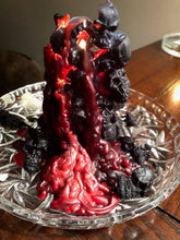 Load image into Gallery viewer, Creepy bleeding skull candle leaks red bloody colored wax as it burns.  Piles of skulls and bone images make up this pillar-like candle.  This custom made cryptic, gothic candle is great for Halloween decorations, gifts for skull loving friends, gothic decor, fall decor or just scary decor.  
