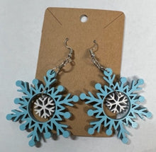 Load image into Gallery viewer, Add a bit of Christmas cheer to any outfit with these beautiful Snowflake Earrings.
