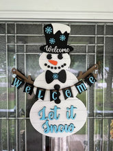 Load image into Gallery viewer, Let this adorable Snowman or Snowwoman Door Hanger welcome your guest this winter.

