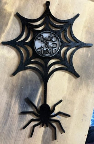 This creepy spider hanging out of her web welcomes everyone to your home.  Great for Halloween decor.