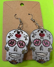 Load image into Gallery viewer, Add a bit of Halloween flare to any outfit with these Sugar Skull Earrings!  The perfect way to welcome in the Day of the Dead or Halloween season.  Also makes a fantastic gift.
