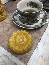 Load image into Gallery viewer, Adorable Sunflower shaped beeswax candle. This bright and cheery beeswax candle is sure to brighten everyone&#39;s day. A slight shimmer of gold mica in the center adds a touch of whimsey to this summer favorite.

