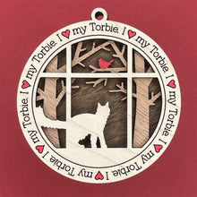 Load image into Gallery viewer, Share the love for our furry friends with these beautiful cat ornaments!  100 different options available.  Send us the name you&#39;d like personalized on it &amp; we&#39;ll add it to your ornament.  Our standard background is the trees with the cardinal in them.  If you&#39;d like a different background, please contact us.
