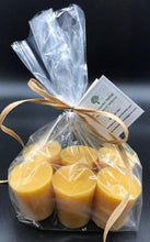 Load image into Gallery viewer, Indulge in these 100% natural, sweet honey-scented beeswax votive candles. These handmade candles are made with nothing but pure beeswax and burn for at many hours each. They may be little, but they pack a bright-glowing punch.
