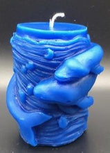 Load image into Gallery viewer, Mother and baby whale swirl around the outside of this all natural beeswax candle. Around the whales is an ocean wave design. Handmade in the USA.  Blue Shown.  Also available in natural yellow beeswax.
