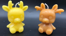 Load image into Gallery viewer, Cute reindeer beeswax candle ready for Christmas decorating.
