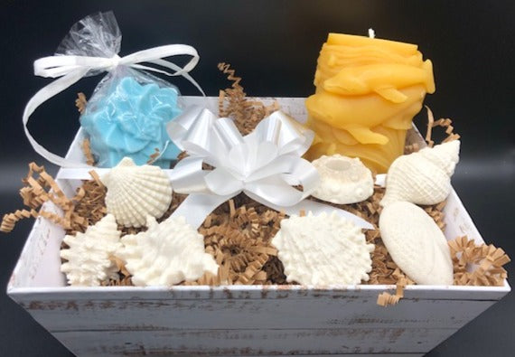 Our Ocean Dreams Gift Basket is filled with soaps and a Whale Beeswax Candle that transport you right back to the beach while you watch the waves & the whales breach.  Imagine the soft sand beneath your feet as the soft glow of our beeswax candle relaxes your stresses away.  The lingering scent of our Ocean Breeze Soaps tantalize your senses to make the dream complete.   Ocean Dreams Gift Basket all packaged ready for your gift giving needs. Perfect for birthday gifts, Christmas gifts or just to let someone