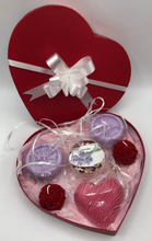 Load image into Gallery viewer, Unique Valentines Day Gift in red, heart shaped gift box. Set includes 2 Lavender Goat&#39;s Milk or Oatmeal Soaps, 1 Lavender Bath Bomb, 1 Lavender or Rose Geranium scented Heart Shaped Goat&#39;s Milk Soap &amp; 2 Beeswax Red Rose Ball Candles. Perfect for Valentines Day Gifts!
