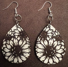 Load image into Gallery viewer, Our beautiful Sunflower Dangle Earrings - the perfect accessory for anyone who loves nature and wants to add a touch of sunshine to their outfit!  These earrings feature stunning sunflower designs with intricate details and vibrant colors that will make you feel like you&#39;re walking through a field of sunflowers. The dangle style of these earrings allows for movement and adds an extra element of fun to your look.
